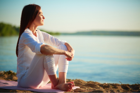 I have received the benefits of visualization just by taking a moment to visualize the outcome of a coaching conversation.  Here, a woman sits peacefully on the beach.