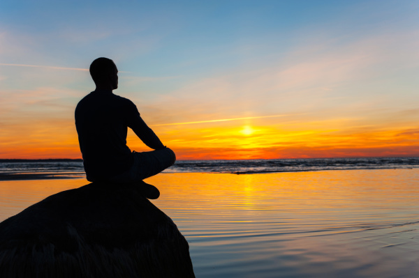 man relaxing by the sea