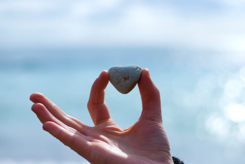 A heart shaped stone representing the love that is required for a good/peace rendering forgiveness prayer.